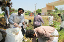 Staff involving cleaning activities infront of N.I.E.P.M.D Campus